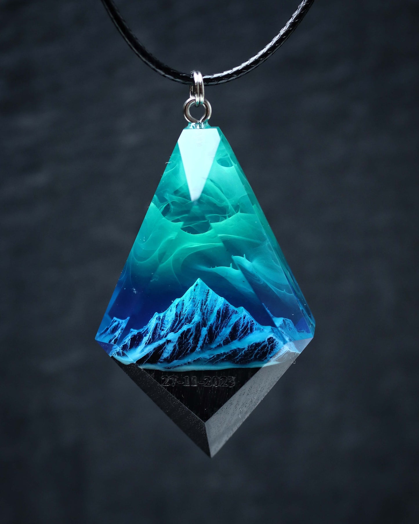 Wood resin necklace with Aurora Borealis sky over blue snowy mountains, faceted rhombus pendant, handmade jewelry
