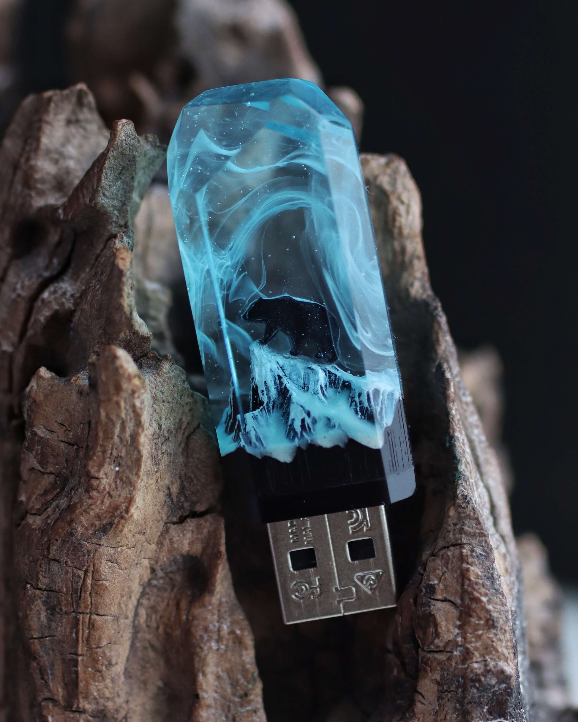 Unique resin and wood USB flash drive displayed on natural wood