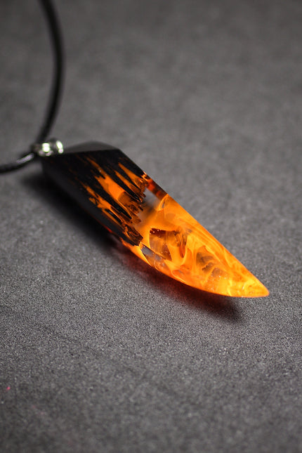Epoxy resin and wood Fire Fang pendant