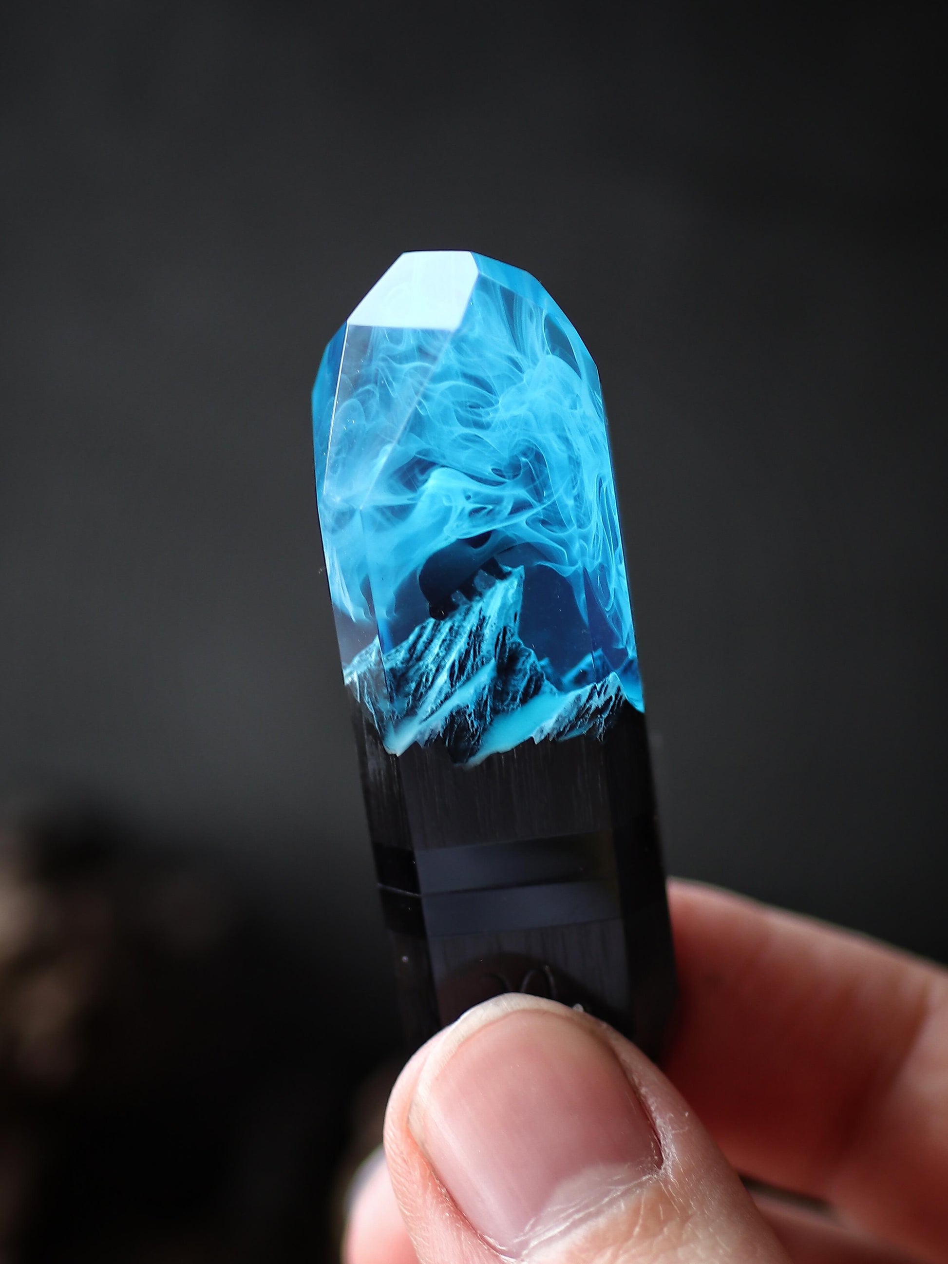 Hand holding crystal resin and wood USB stick handmade