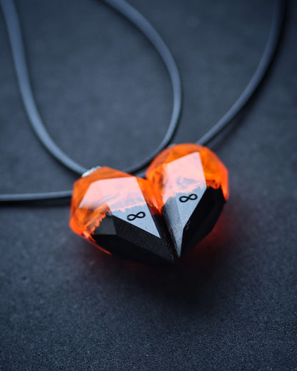 Couple pendants handmade from resin and wood with fire effect