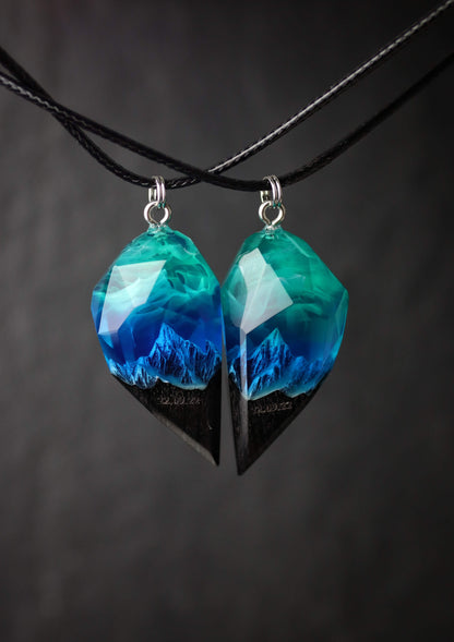 Couple resin and wood pendants with mountain landscape design