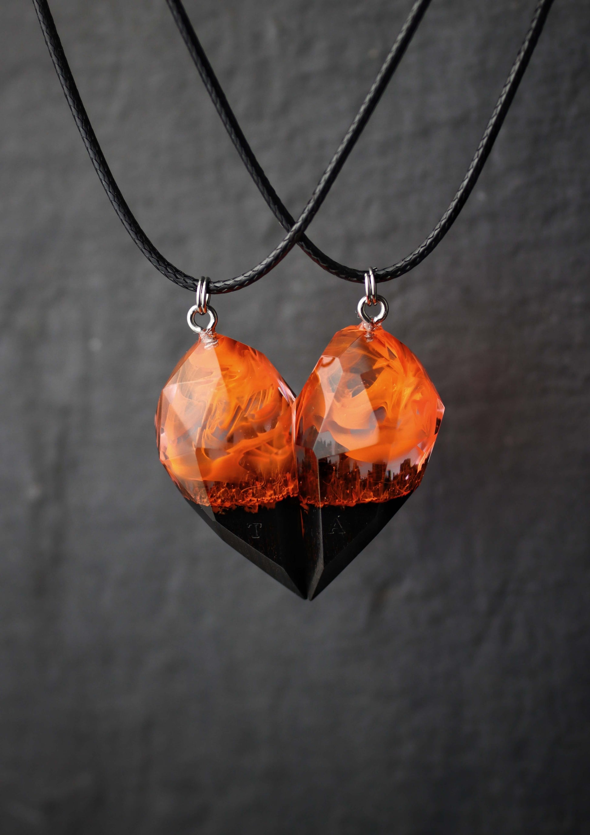 Pair of resin and wood crystal couple pendants with fiery glow