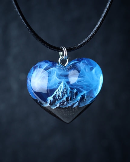 Epoxy resin and wood Mountain Heart Blue pendant