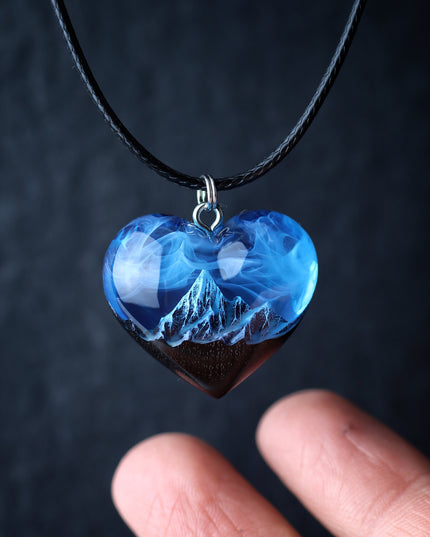 Epoxy resin and wood Mountain Heart Blue pendant