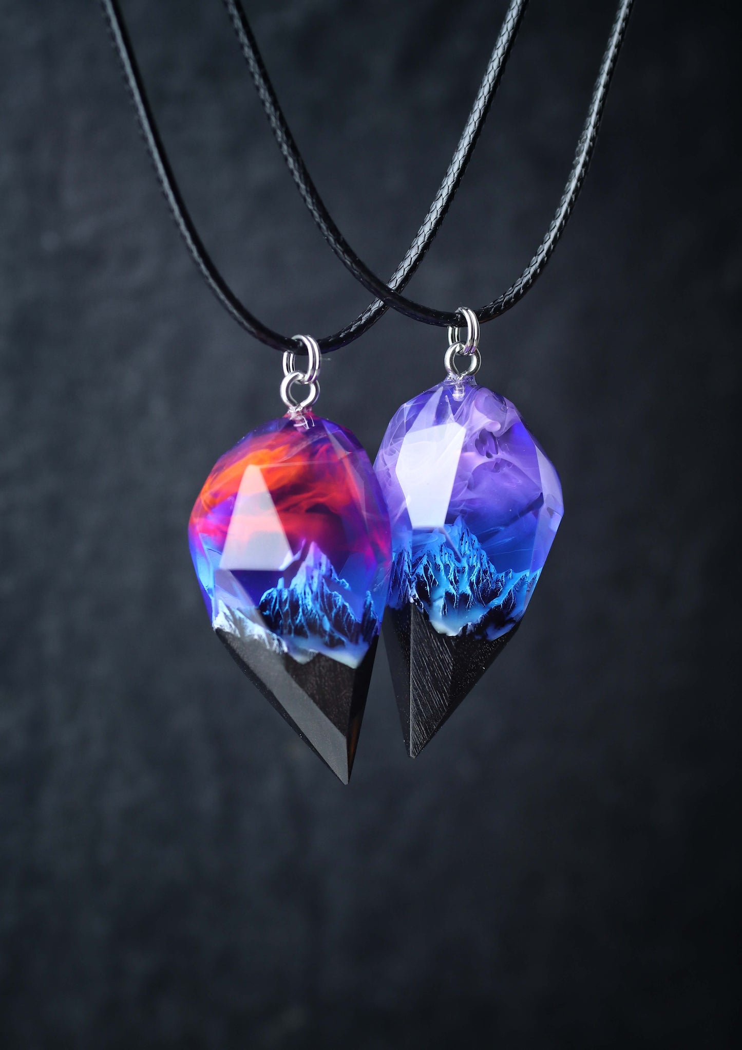 Pair of resin and wood crystal pendants with galaxy sky and mountains