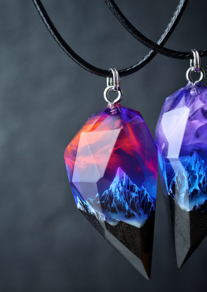 Pair of resin and wood crystal pendants with galaxy sky and mountains