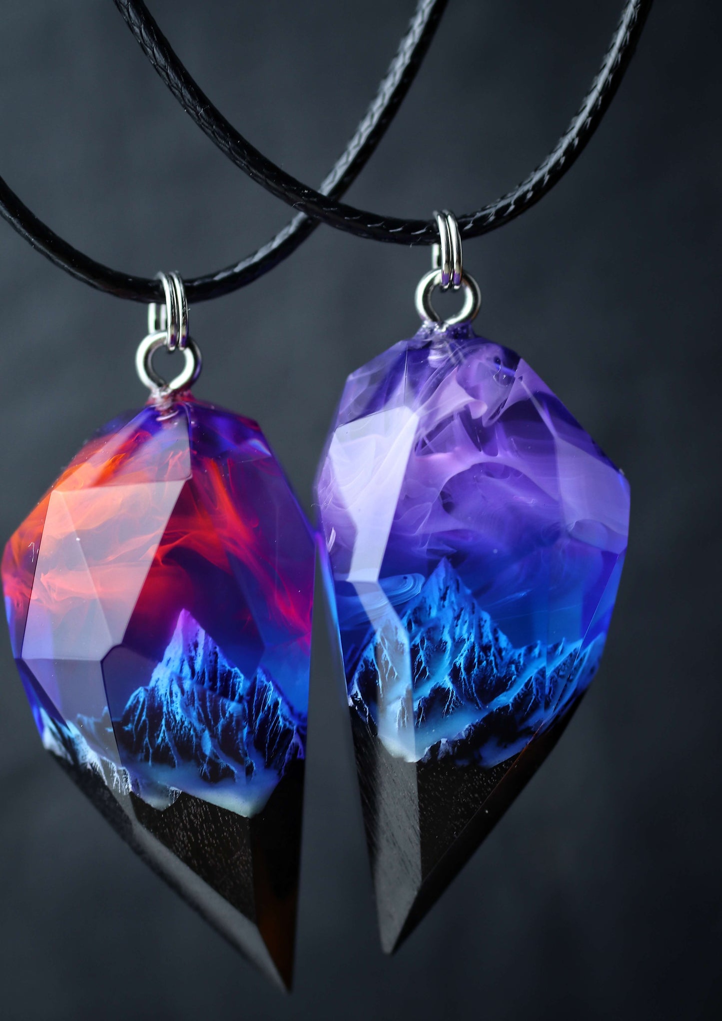 Pair of resin and wood crystal pendants with galaxy sky and mountains