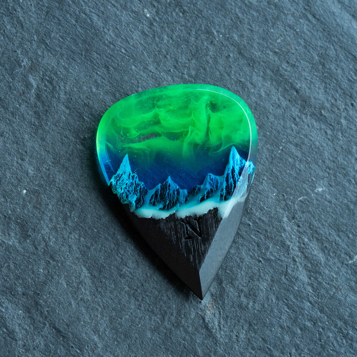 Emerald Aurora Mountain guitar pick