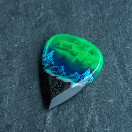 Emerald Aurora Mountain guitar pick