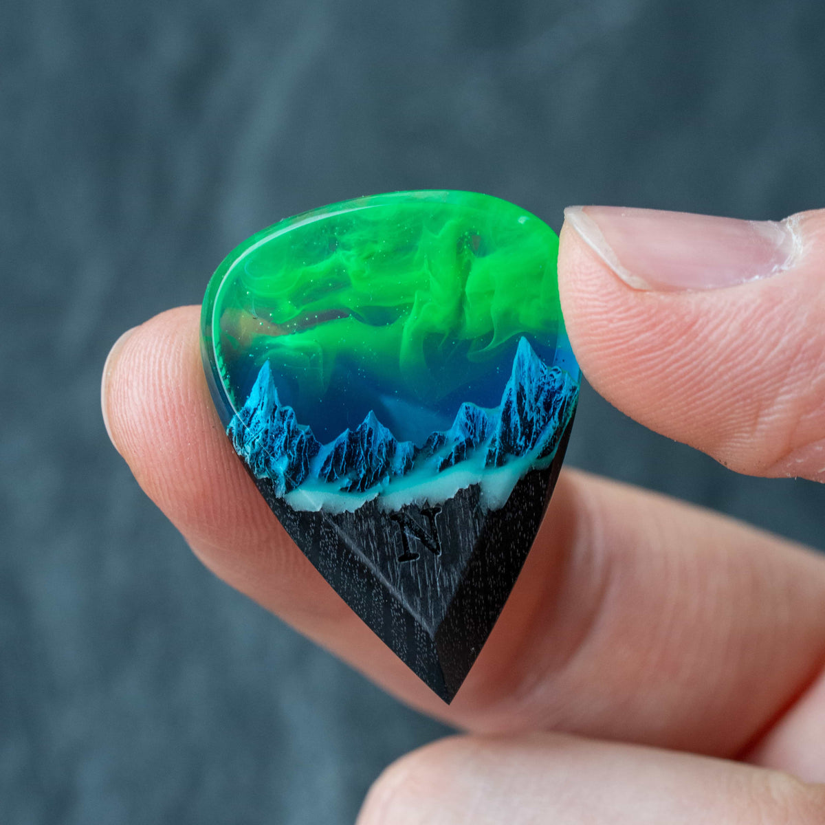 Emerald Aurora Mountain guitar pick