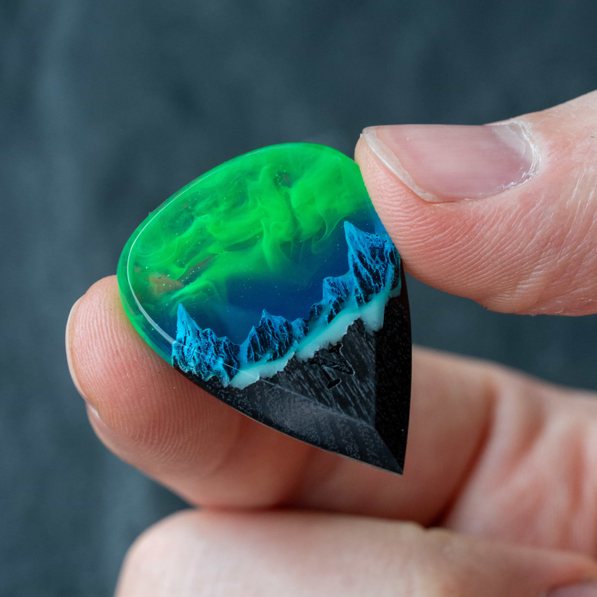 Emerald Aurora Mountain guitar pick