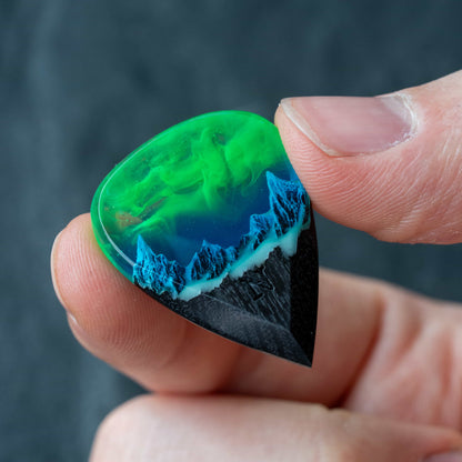 Emerald Aurora Mountain guitar pick